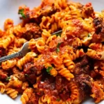 Herzhafter Nudelauflauf mit Hackfleisch und Käsekruste 4 Herzhafter Nudelauflauf mit Hackfleisch und Käsekruste